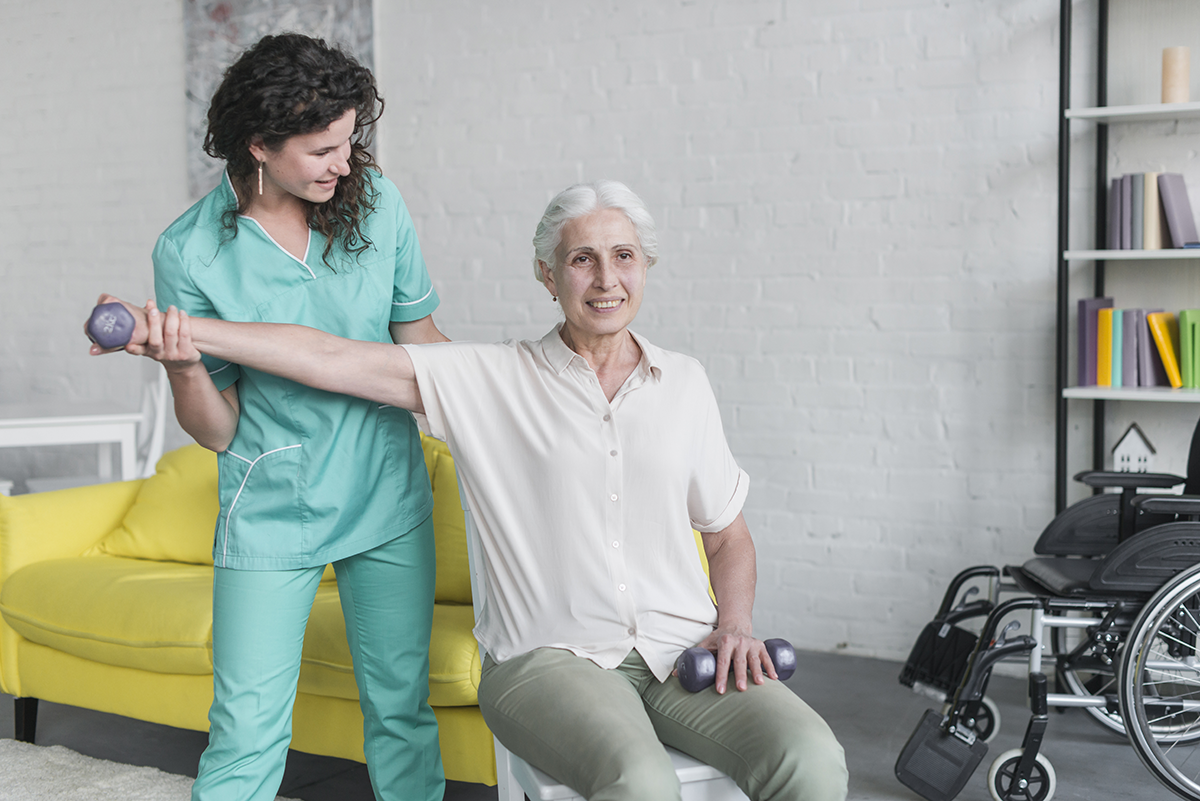 Healthcare professional assisting patient with rehabilitation